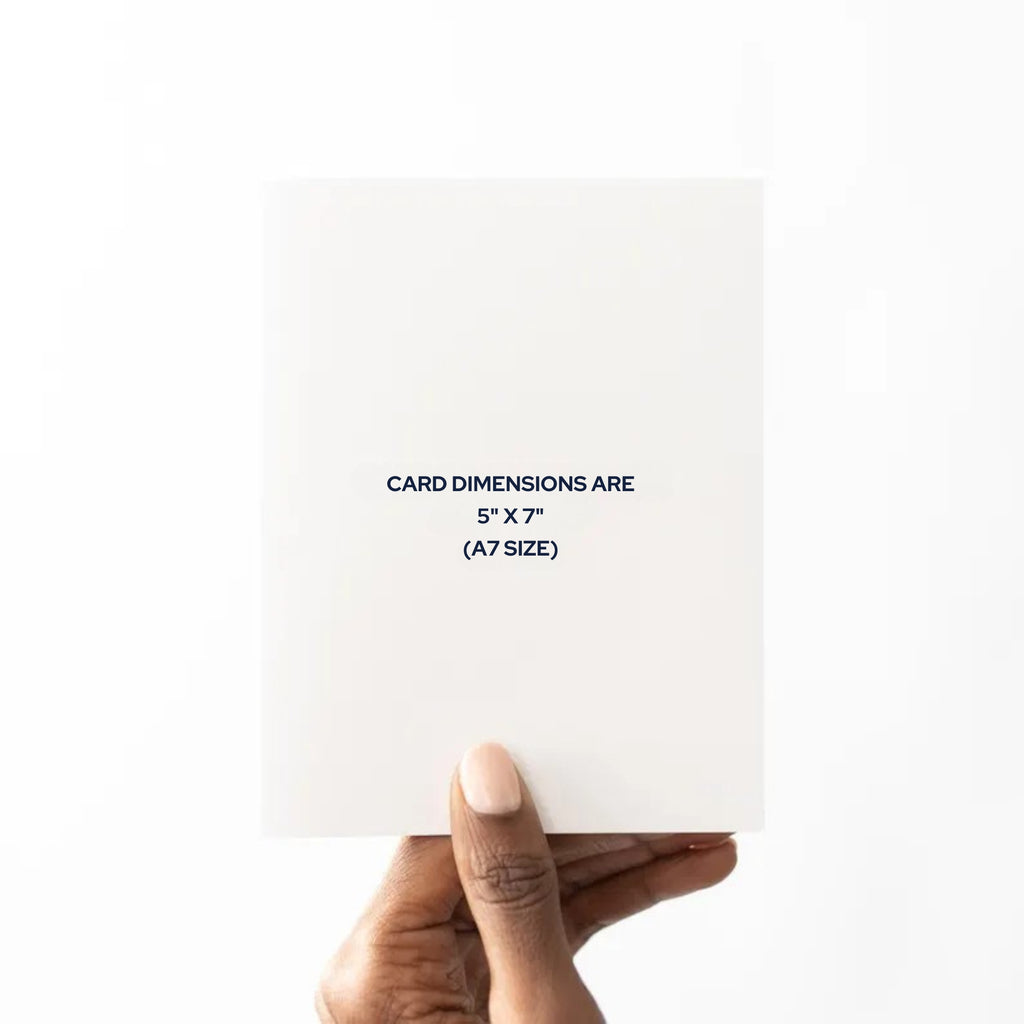 Hand holding a white card with dimensions text on a white background