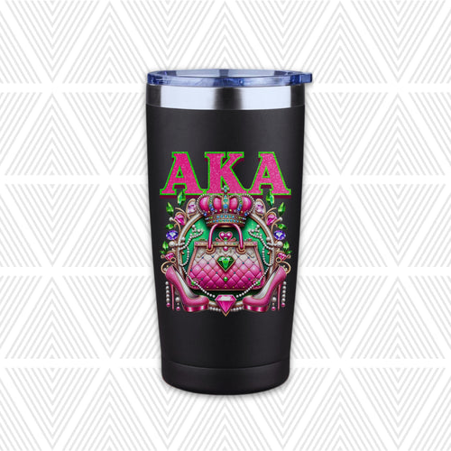 A black insulated travel tumbler with a clear lid, featuring a colorful graphic of a pink quilted handbag under a crown and the letters 'AKA' in pink, set against a white and gray patterned background.