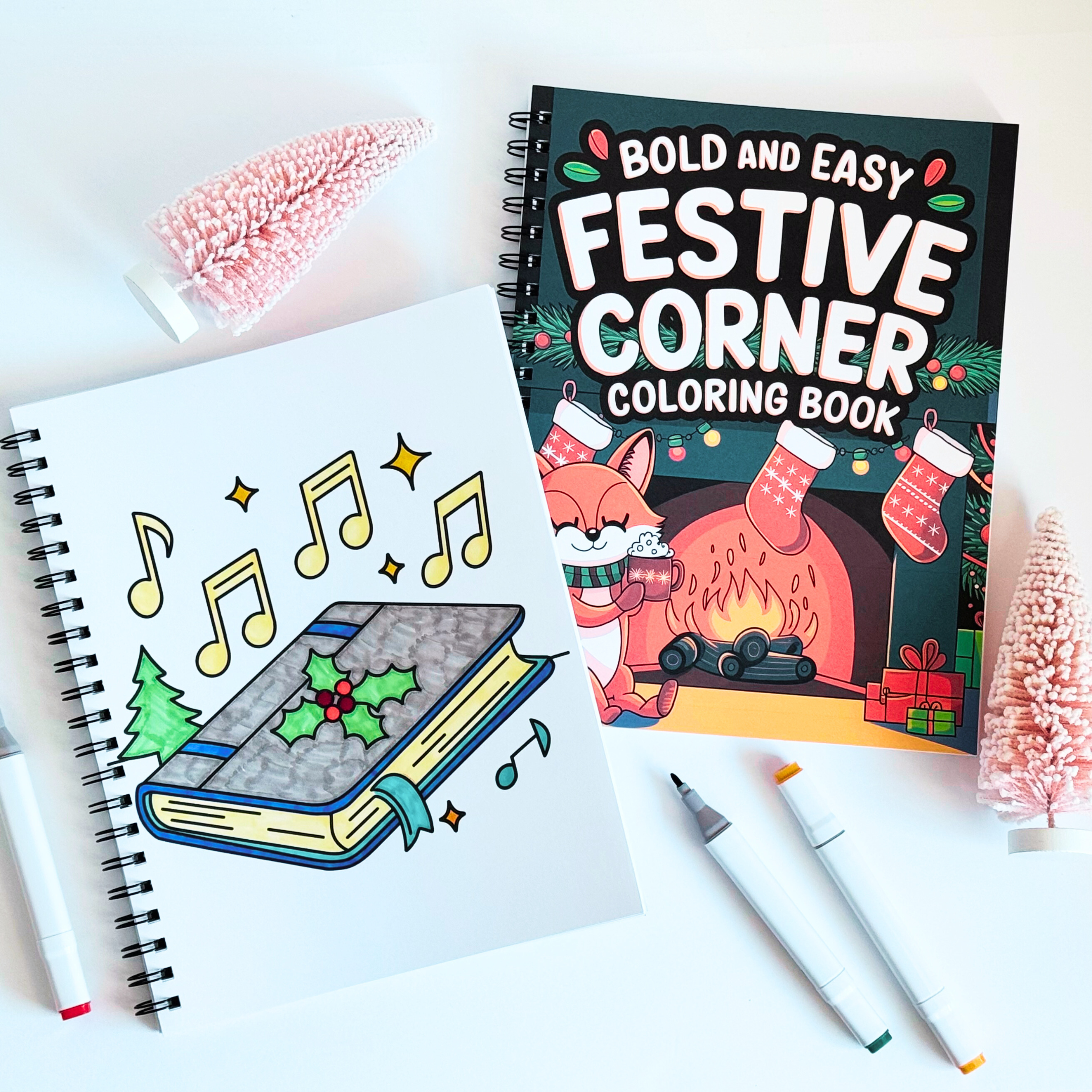 Coloring book titled 'Bold and Easy Festive Corner Coloring Book' with a page featuring musical notes and a book.