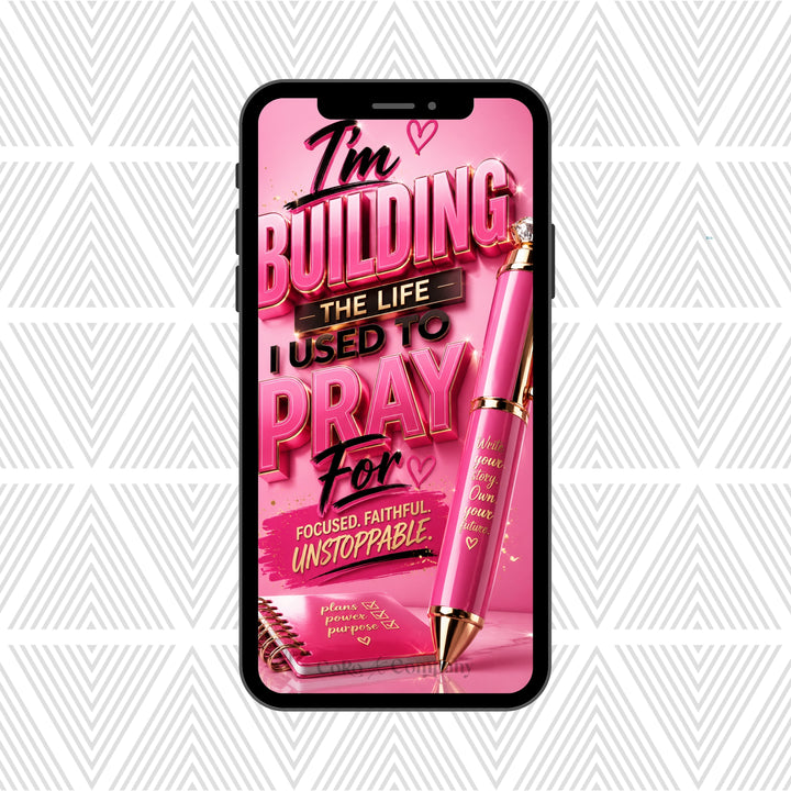 A pink smartphone mockup centered on a white geometric patterned background, displaying a motivational quote poster design with the text 'I'm Building The Life I Used To Pray For' and a pink pen illustration.