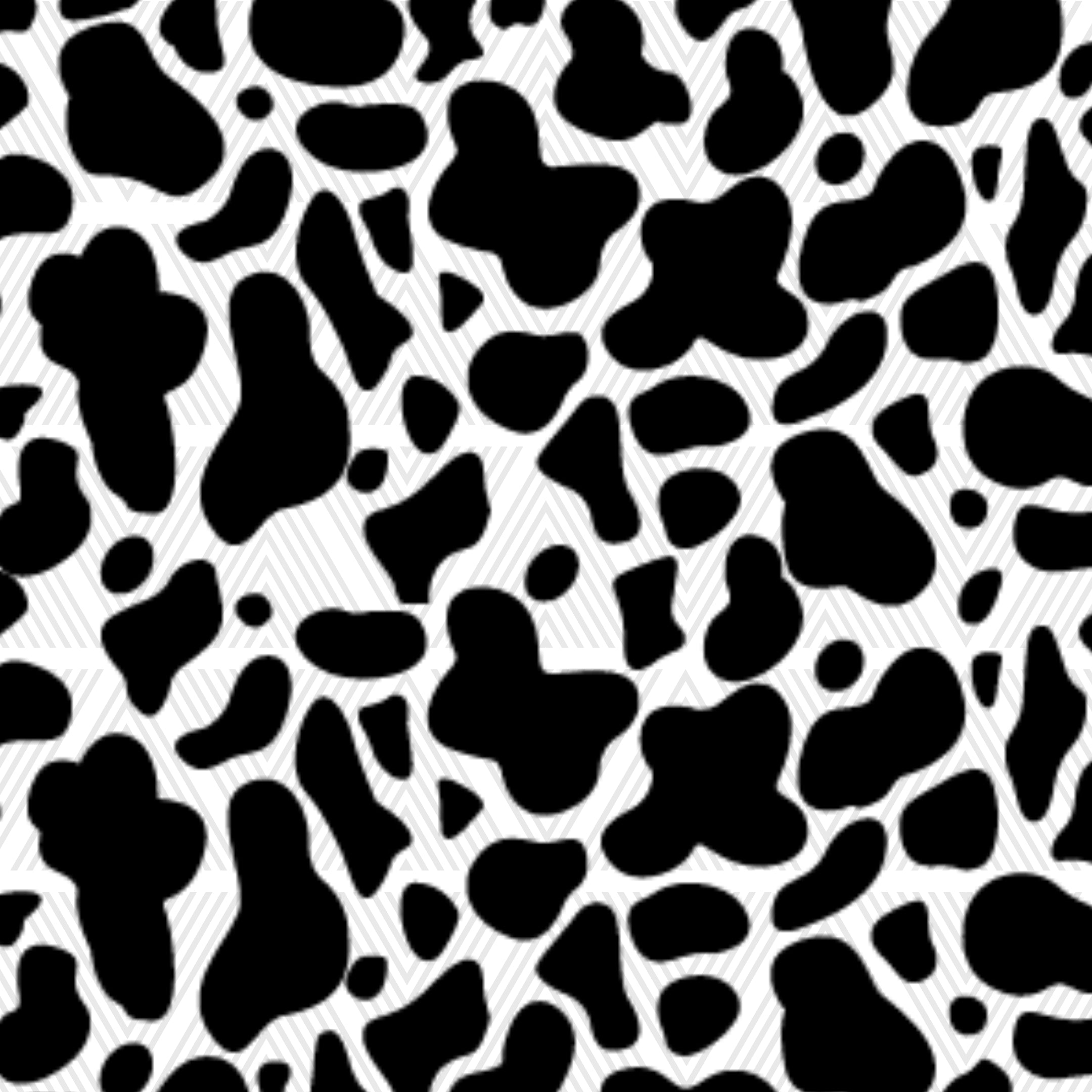 Black and white cow print pattern with irregular black spots on a white background.