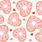 Pattern of heart-shaped cookies with pink icing and red heart decorations on a white background.