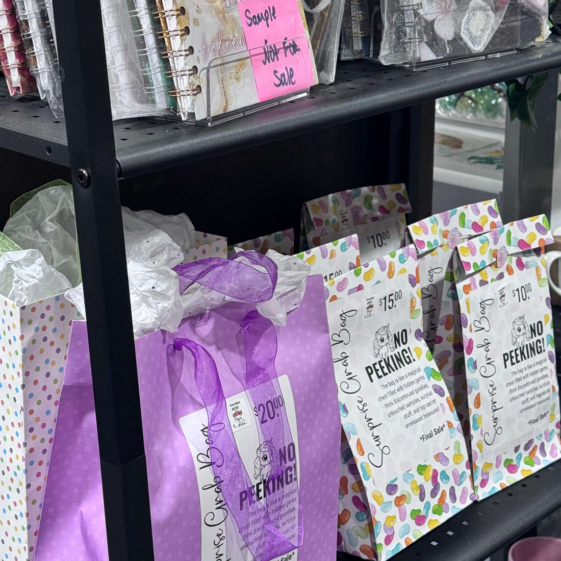 Stationery items including notebooks and cards on a shelf.