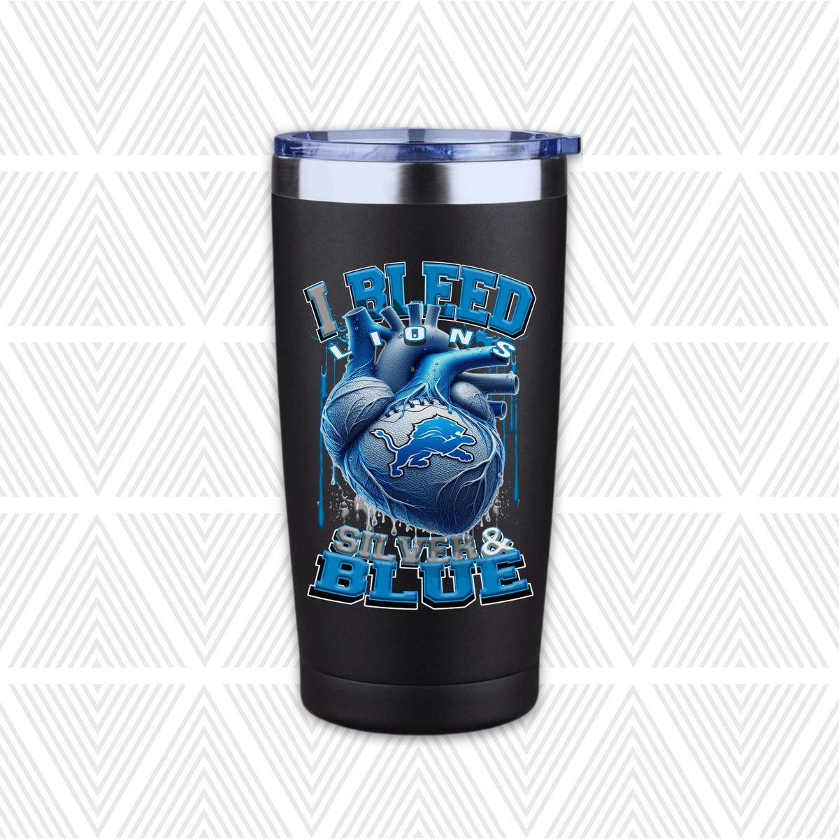 A black insulated travel tumbler with a blue lid, featuring a graphic of a blue anatomical heart with the Detroit Lions logo and the text 'I BLEED LIONS SILVER & BLUE.'