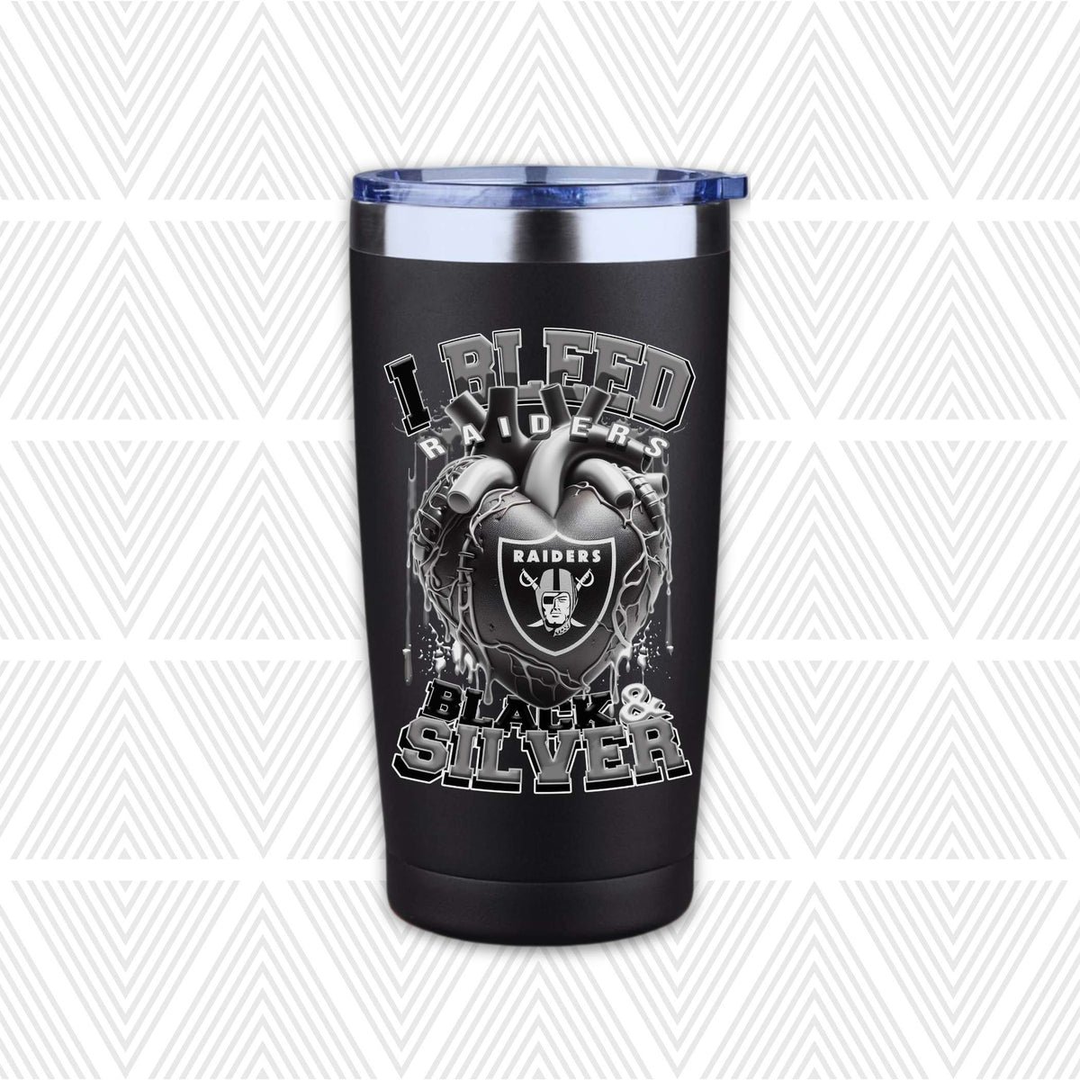 A black insulated tumbler with a clear lid, featuring a Raiders-themed graphic with the text 'I BLEED RAIDERS' and 'BLACK & SILVER' around a Raiders shield and anatomical heart design, shown on a white patterned background.