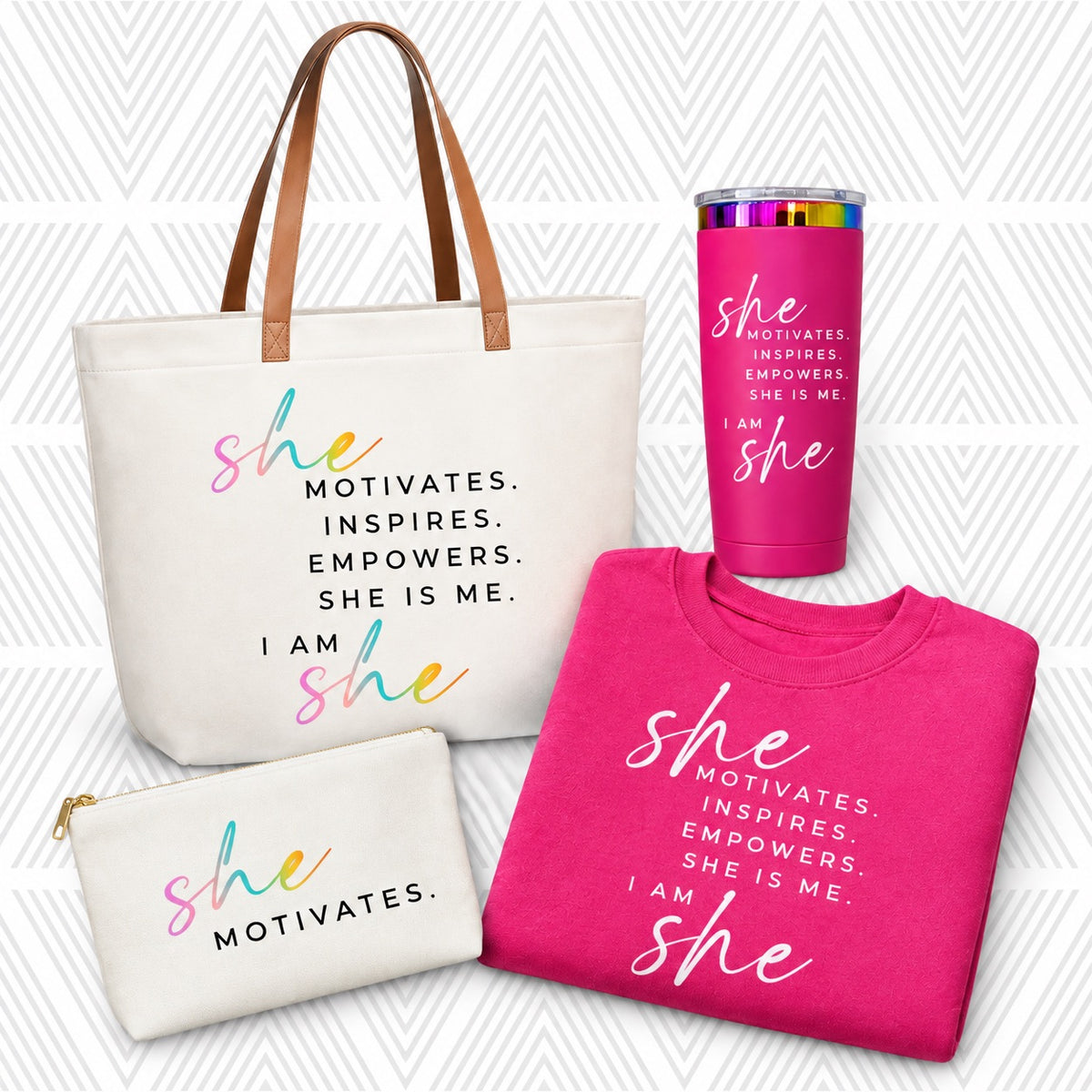 A coordinated hot pink gift set of branded accessories and apparel featuring the phrase 'SHE MOTIVATES.'