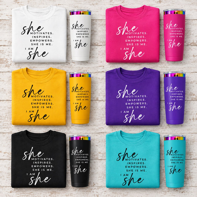 Six folded apparel items and matching tumblers arranged in a grid on a light wood background. Each set includes a sweatshirt and insulated tumbler in different colorways: white, bright pink, mustard yellow, purple, black, and turquoise.