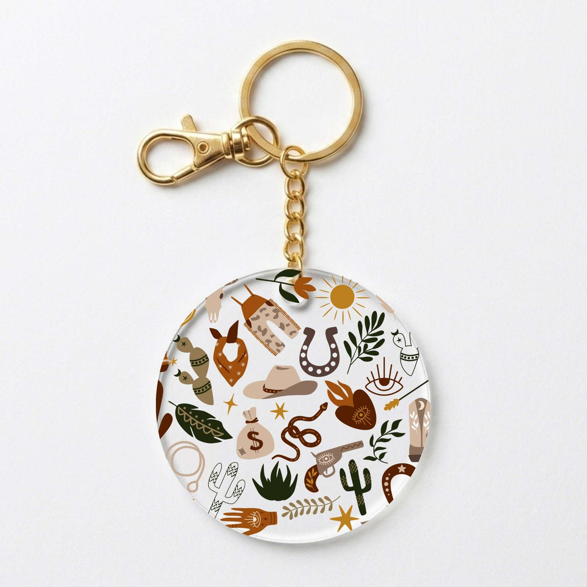 A round acrylic keychain charm featuring a western-themed doodle pattern with a gold-tone split ring and clasp, shown on a clean white background.