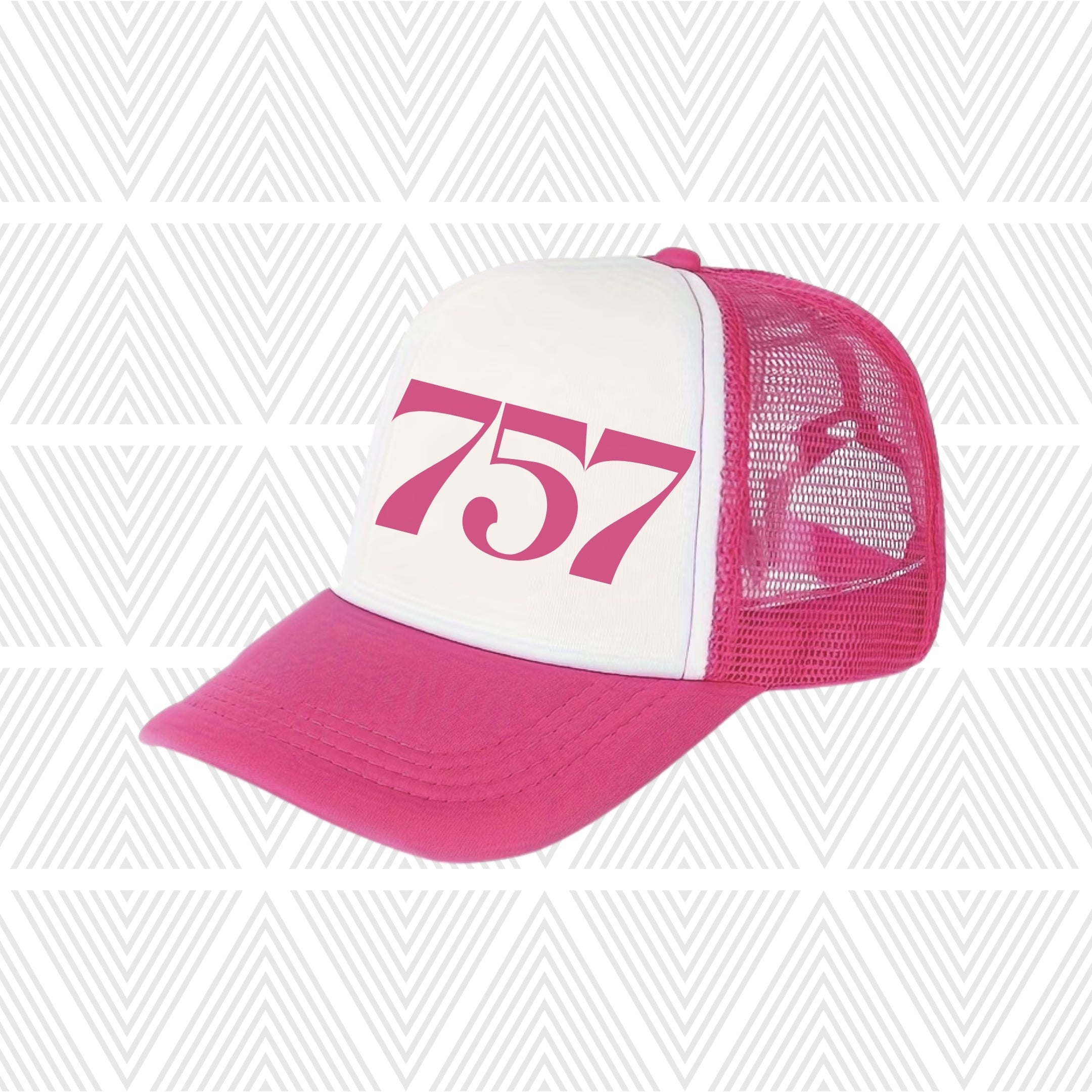 Hot pink and white trucker hat with area code '757' logo on a geometric patterned background
