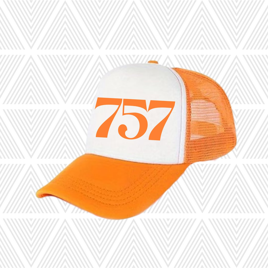 Orange and white trucker hat with '757' area code printed on a geometric patterned background