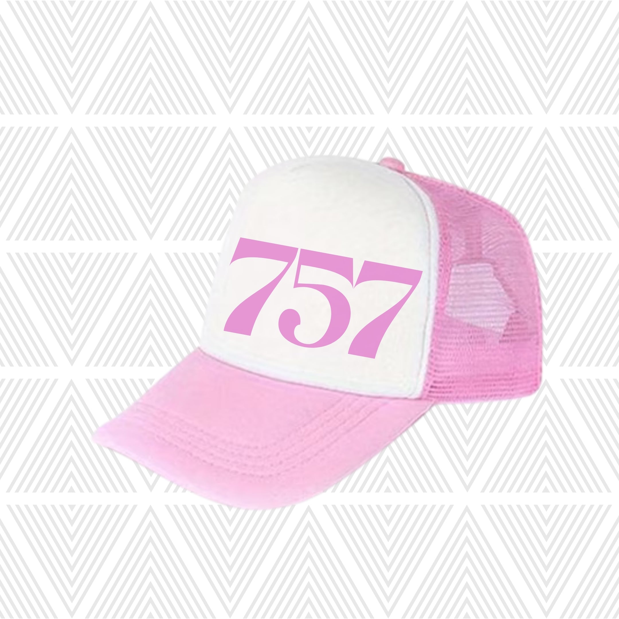Pink and white cap with area code  '757' printed on a geometric patterned background