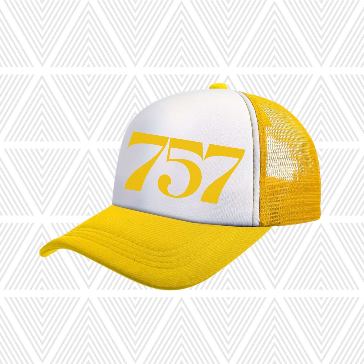 Yellow and white cap with area code '757' printed on a geometric patterned background